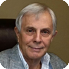 Senior man smiling in office chair