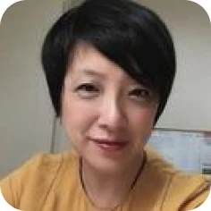Woman wearing a mustard-colored top
